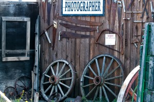 a wall with saws and a photographer's sign